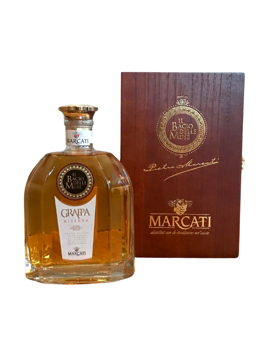 Marcati Grappa Riserva in wooden gift box with amber liquid